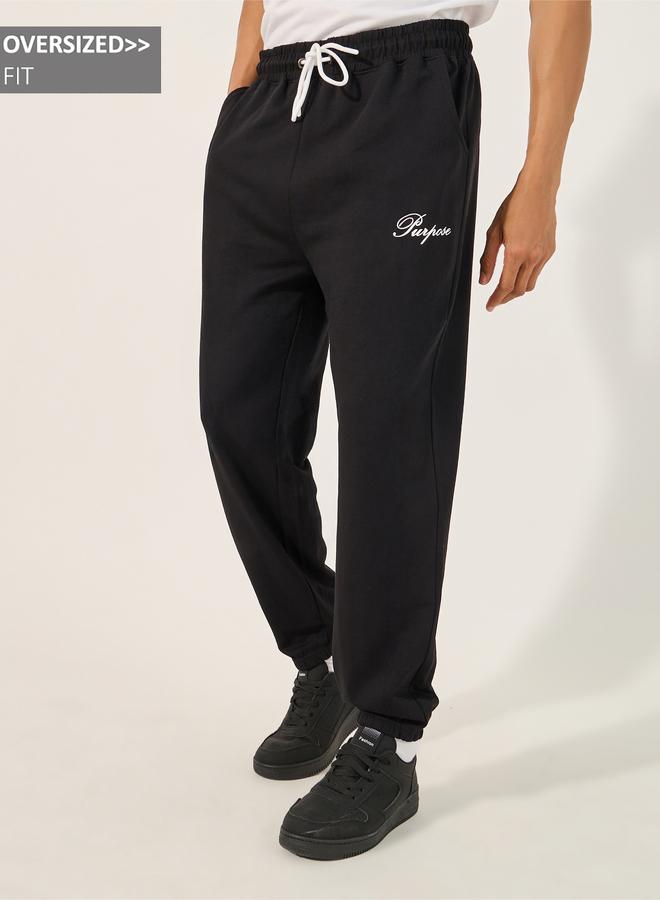 Styli Styli Minimal Slogan Print Oversized Joggers with Drawstring - Image 1