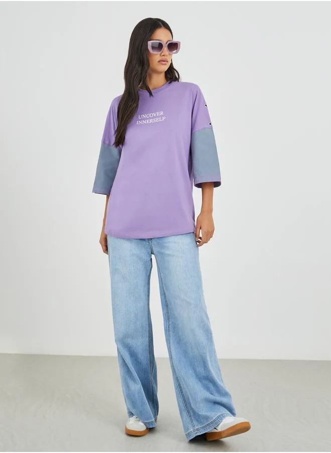 ستايلي Styli Spray Painted Exaggerated Shoulder Oversized T-Shirt with Eyelet Detail