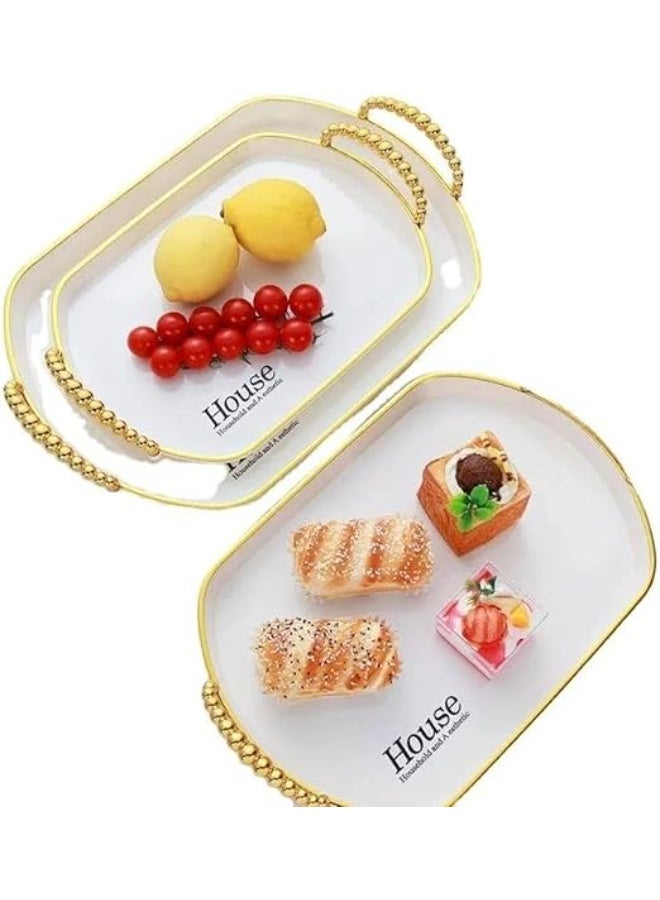 An oval geometric serving tray made of luxurious transparent material, embellished with gold accents and elegant handles, for smartly coordinating hospitality. - Image 1