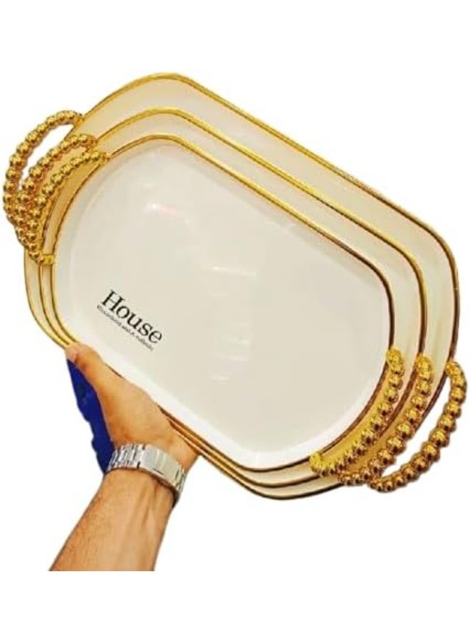 An oval geometric serving tray made of luxurious transparent material, embellished with gold accents and elegant handles, for smartly coordinating hospitality. - Image 2