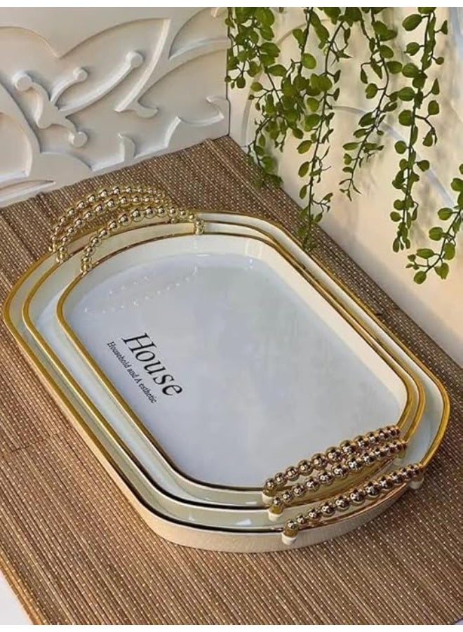 An oval geometric serving tray made of luxurious transparent material, embellished with gold accents and elegant handles, for smartly coordinating hospitality. - Image 3