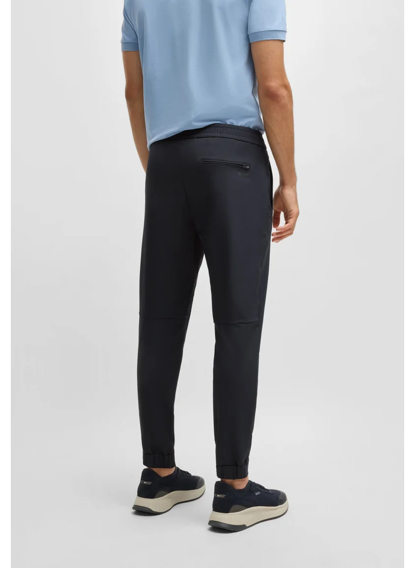 BOSS Tapered-fit trousers in water-repellent stretch fabric