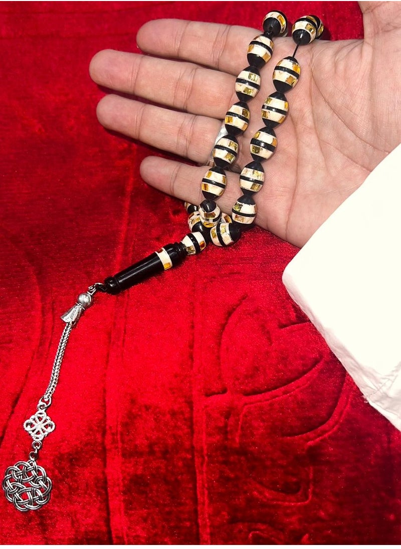 Generic - Luxurious rosary made of natural cocoa wood It contains a metal Trabzon tassel, characterized by its beautiful details as it contains a mixture of shells and wonderful mirrors and a soft cylindrical shape, designed to show the elegance of its owner and the strength of his presence, elegance and high taste, the thread is characterized by overlapping colors and is durable and cohesive, contains 33 beads 8 mm, its weight is suitable and suits all tastes and ages. We offer it in a box to make it easy to gift to family, loved ones and friends Suitable for all seasons Hajj, Umrah, Ramadan and holiday decorations - Image 1