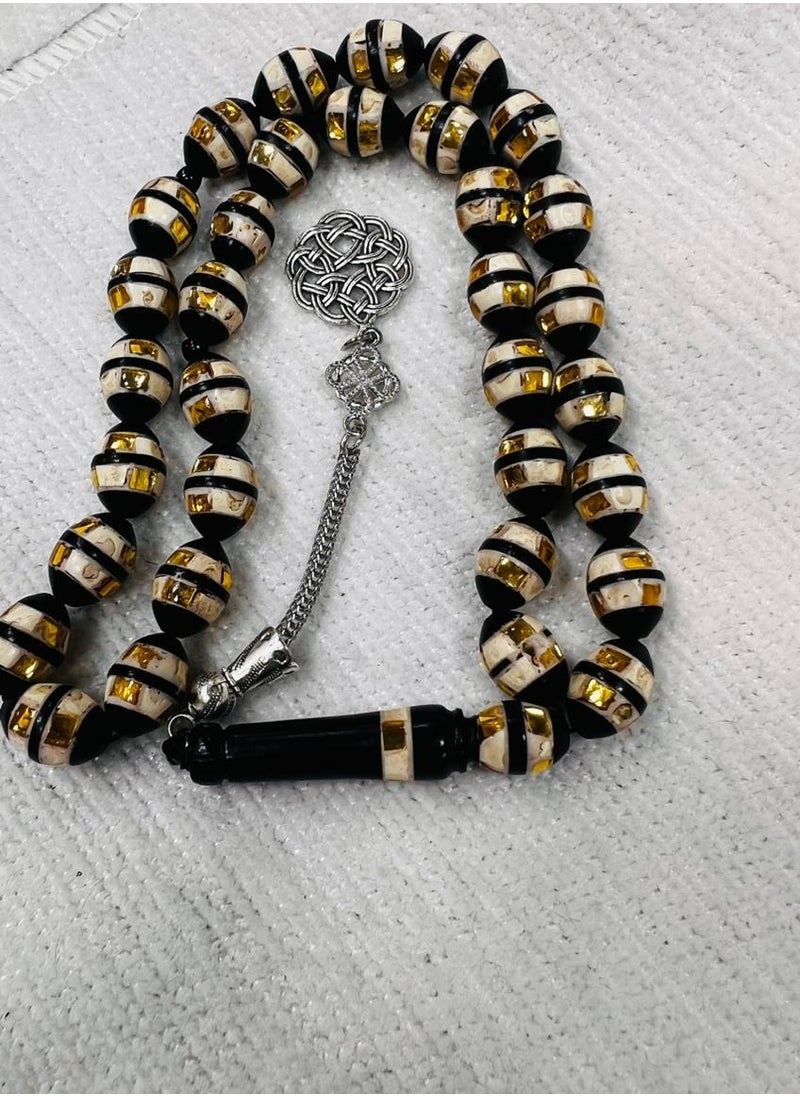 Generic - Luxurious rosary made of natural cocoa wood It contains a metal Trabzon tassel, characterized by its beautiful details as it contains a mixture of shells and wonderful mirrors and a soft cylindrical shape, designed to show the elegance of its owner and the strength of his presence, elegance and high taste, the thread is characterized by overlapping colors and is durable and cohesive, contains 33 beads 8 mm, its weight is suitable and suits all tastes and ages. We offer it in a box to make it easy to gift to family, loved ones and friends Suitable for all seasons Hajj, Umrah, Ramadan and holiday decorations - Image 1