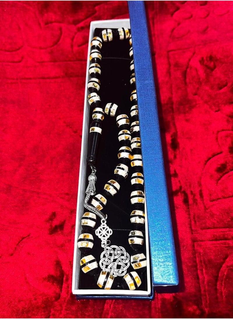 Generic - Luxurious rosary made of natural cocoa wood It contains a metal Trabzon tassel, characterized by its beautiful details as it contains a mixture of shells and wonderful mirrors and a soft cylindrical shape, designed to show the elegance of its owner and the strength of his presence, elegance and high taste, the thread is characterized by overlapping colors and is durable and cohesive, contains 33 beads 8 mm, its weight is suitable and suits all tastes and ages. We offer it in a box to make it easy to gift to family, loved ones and friends Suitable for all seasons Hajj, Umrah, Ramadan and holiday decorations - Image 1