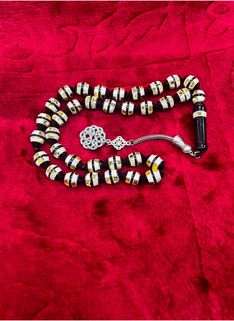Generic - Luxurious rosary made of natural cocoa wood It contains a metal Trabzon tassel, characterized by its beautiful details as it contains a mixture of shells and wonderful mirrors and a soft cylindrical shape, designed to show the elegance of its owner and the strength of his presence, elegance and high taste, the thread is characterized by overlapping colors and is durable and cohesive, contains 33 beads 8 mm, its weight is suitable and suits all tastes and ages. We offer it in a box to make it easy to gift to family, loved ones and friends Suitable for all seasons Hajj, Umrah, Ramadan and holiday decorations - Image 1