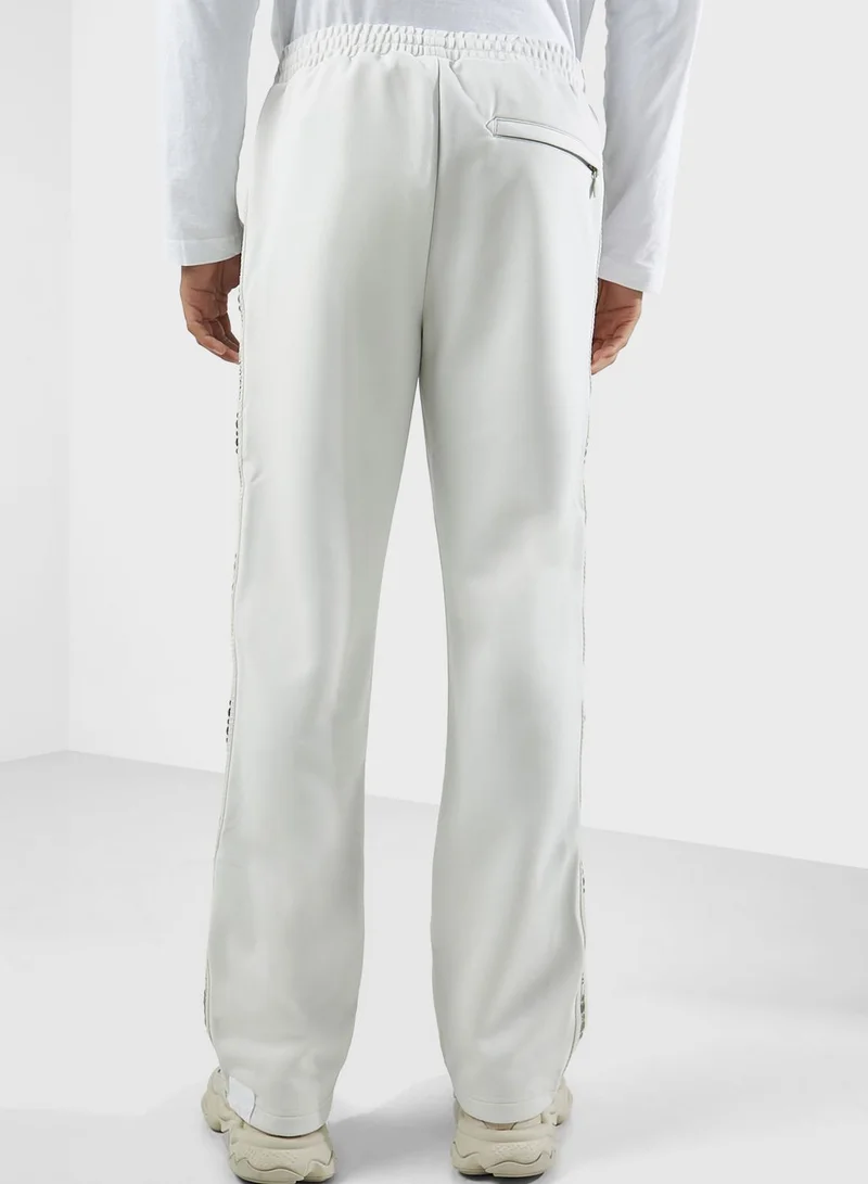 izzue Studs Tape Logo Sweatpants