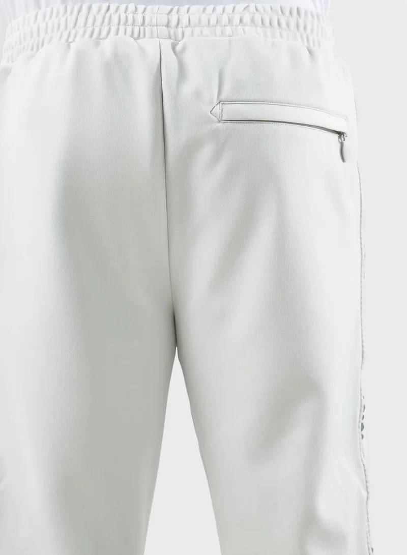 izzue Studs Tape Logo Sweatpants