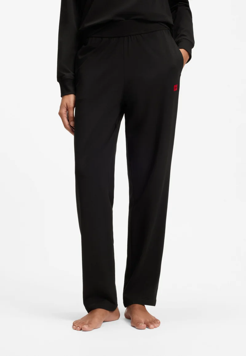 HUGO Tracksuit bottoms in stretch jersey with red logo label