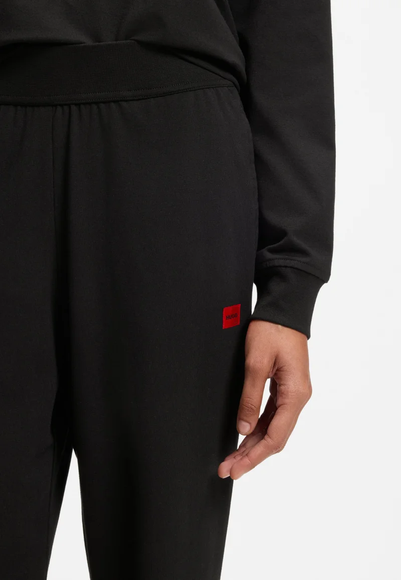 HUGO Black Tracksuit bottoms in stretch jersey with red logo label for Women | Best Price UAE