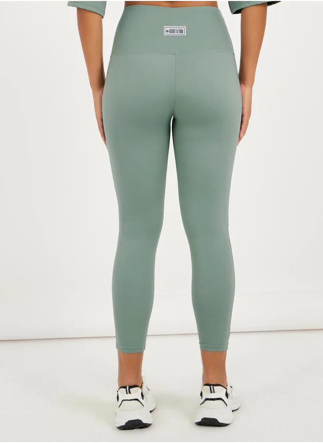 ستايلي Gymspire Edition - Label Ruched Waist 7/8 Leggings