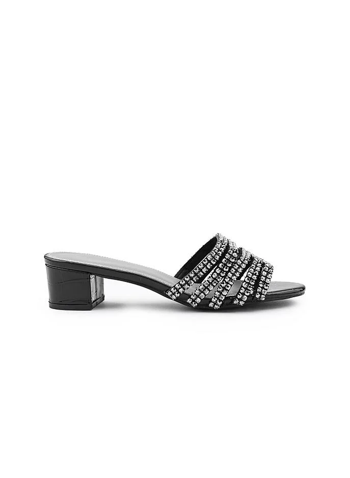 أيقون Crystal heel slipper with a refined finish.