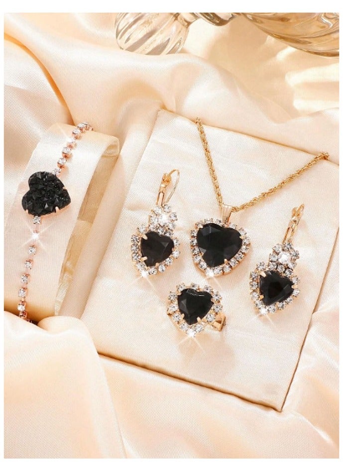Elegant and distinctive women accessories set consisting of chain with pendant design studded with shiny crystals along with earrings bracelet and ring  - Image 1