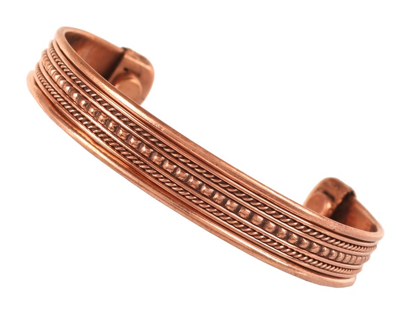Touchstone Handcrafted By Indian Skilled Artisans Durable High Gauge Copper Hand Twisted Pipe Bracelet In Natural Tone. - Image 1
