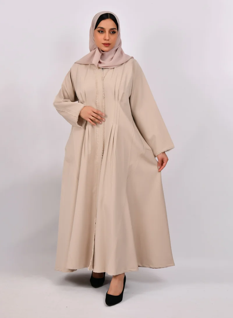 HAWRAA ABAYA Beige wrap abaya with tassels on the edges of the abaya and sleeves, and soft front and back pleats