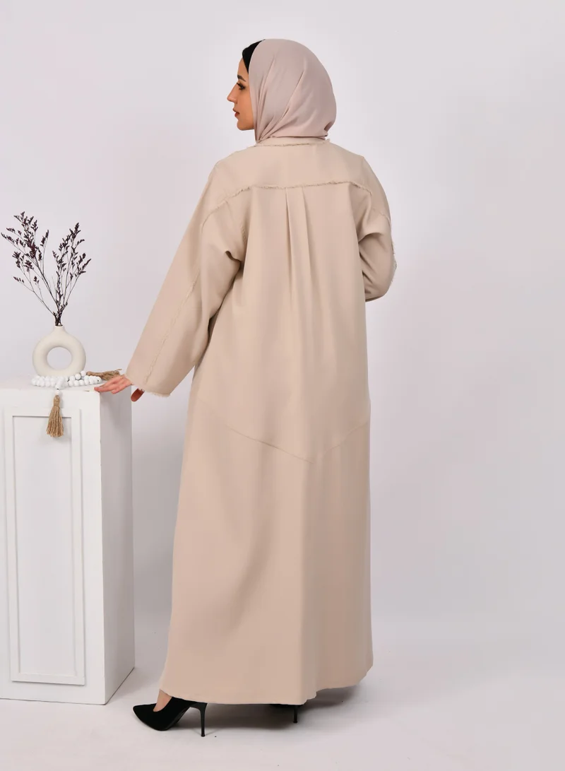 HAWRAA ABAYA Beige wrap abaya with tassels on the edges of the abaya and sleeves, and soft front and back pleats