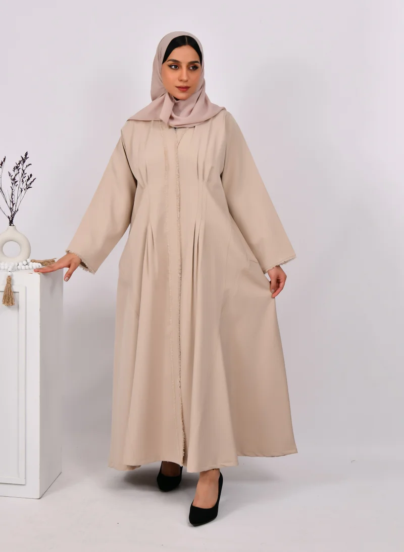 HAWRAA ABAYA Beige wrap abaya with tassels on the edges of the abaya and sleeves, and soft front and back pleats