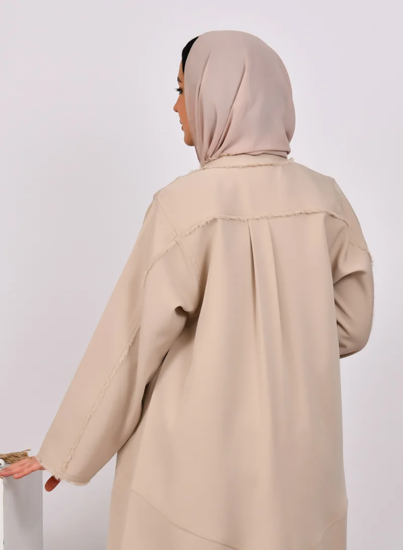 HAWRAA ABAYA Beige wrap abaya with tassels on the edges of the abaya and sleeves, and soft front and back pleats