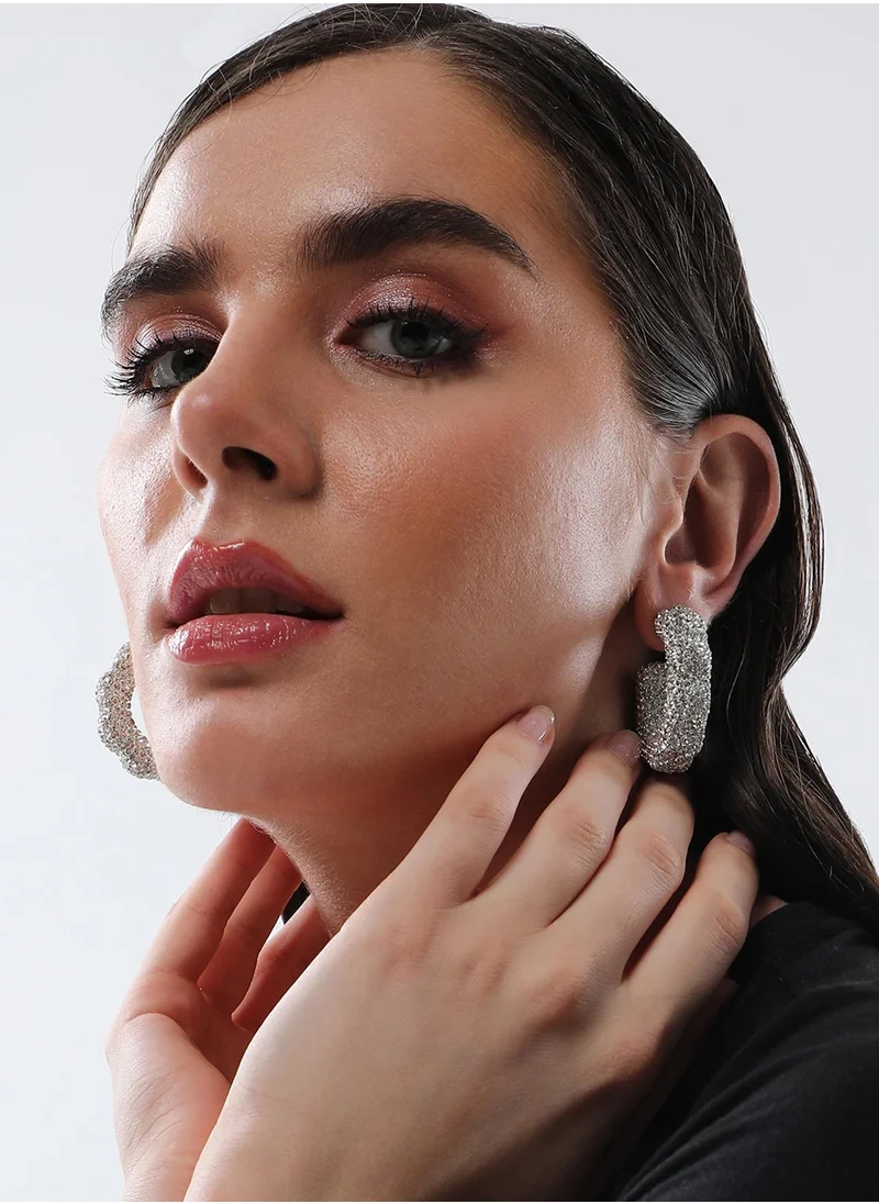 SOHI Jingle Crystal Studded Contemporary Half Hoop Earrings