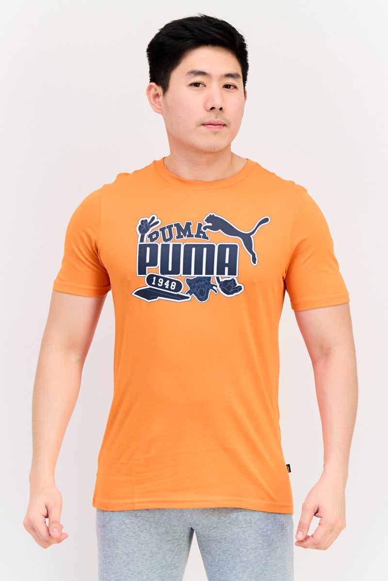 PUMA Men Sportswear Fit Short Sleeve Outdoor T-Shirt, Orange - Image 1