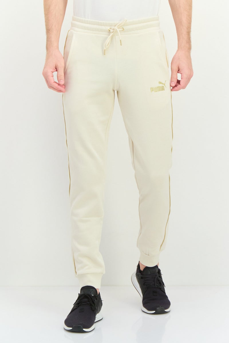 PUMA Men Sportswear Fit Outdoor Sweatpants, Beige - Image 1