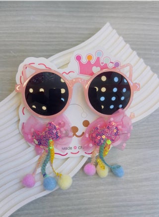 Colorful children's sunglasses with a unique modern design in the shape of a cat, paired with two clips decorated with soft tulle ribbons, shiny colors, and colorful pom-poms, adding a playful and magical touch to your little one's look! 🌟👑 Carefully designed to combine elegance and fun in every detail, perfect for a lively and joyful look, whether for special occasions or daily wear. - pzsku/ZEBCBB7D48B5F5ACD7CABZ/45/1742490505/a715fe17-dbe1-43fe-bde3-9ce6d96fcd4c