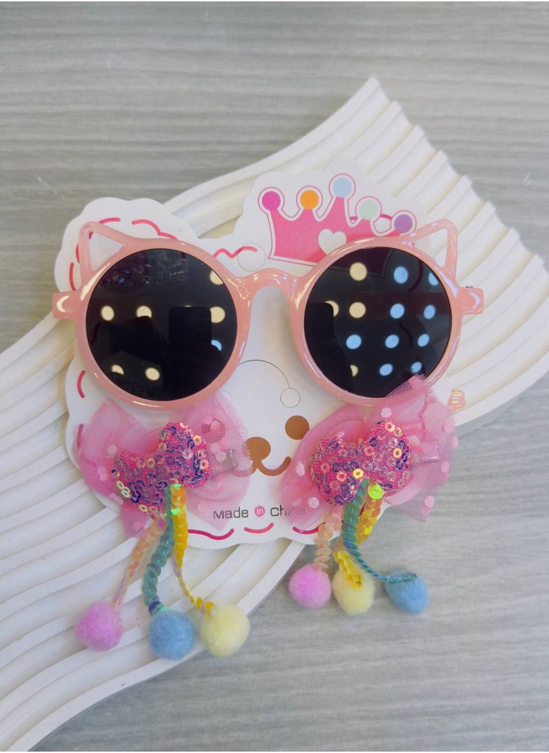 Generic - Colorful children's sunglasses with a unique modern design in the shape of a cat, paired with two clips decorated with soft tulle ribbons, shiny colors, and colorful pom-poms, adding a playful and magical touch to your little one's look! 🌟👑 Carefully designed to combine elegance and fun in every detail, perfect for a lively and joyful look, whether for special occasions or daily wear. - Image 1