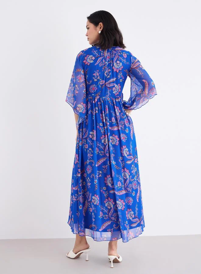 Styli Women Blue Tie-Up Neck Floral Print Maxi Dress