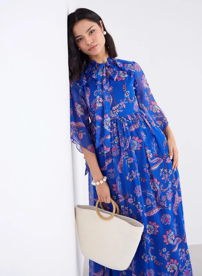 Styli Women Blue Tie-Up Neck Floral Print Maxi Dress