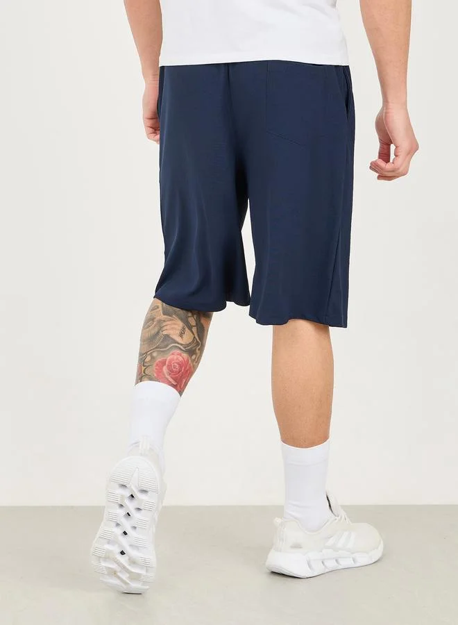 ستايلي Styli Micro Pique Knit Reflective Logo Oversized Training Shorts