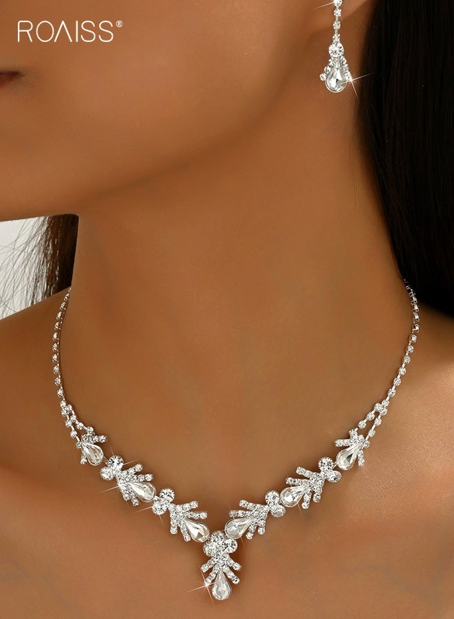 رويس طقم أقراط وقلادة على شكل قطرة ماء مرصعة بأحجار الراين من قطعتين للنساء، عقد تشوكر فضي على شكل دمعة من الكريستال، أقراط متدلية متدلية لحفلات الزفاف وحفلات التخرج، طقم مجوهرات لوصيفات العروس - Image 1
