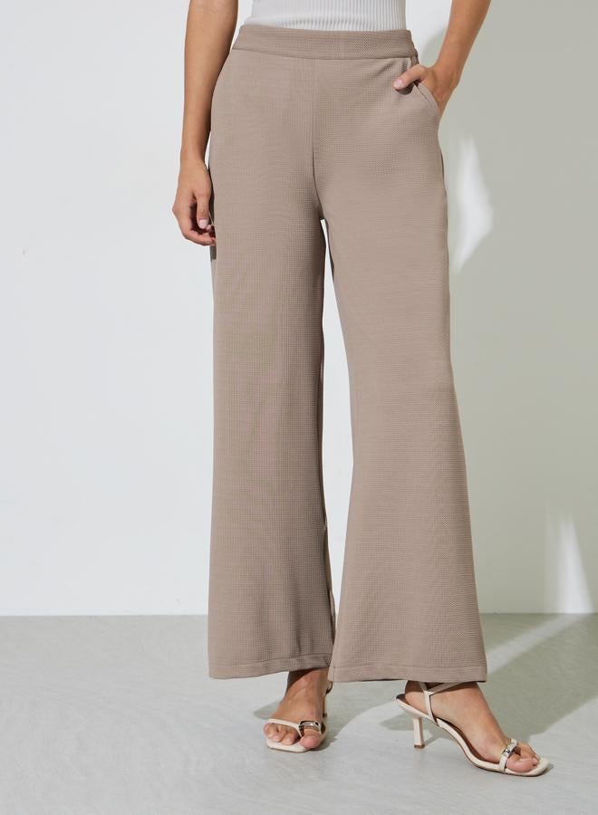 Styli Women Beige Wide Leg Trousers - Image 1