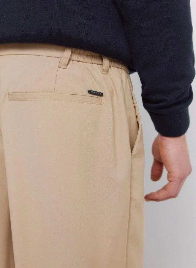 Springfield  Trousers in fluid-look and soft-touch fabric, very comfortable. Elasticated waistband at the back, with an internal drawstring for a better fit. Front seam pockets. Front pleats. Relaxed fit. for Men | Best Price UAE