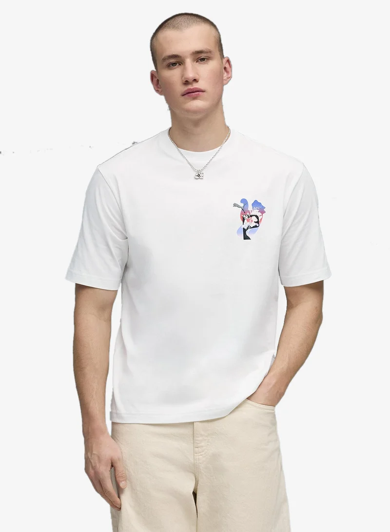 بوما تيشيرت جرافيك بويكسي بطبعة زهرة نفسية