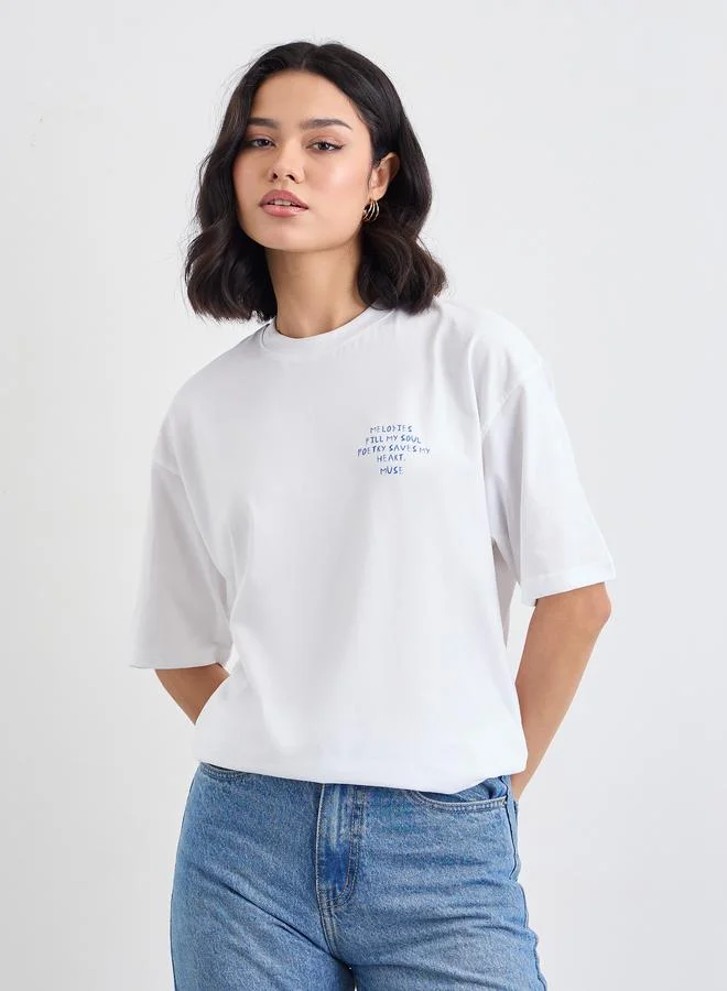 Styli Women White Slogan Print Short Sleeve Oversized T-Shirt