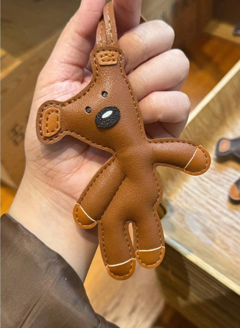 Keychain with a cute dog design, made from high-quality faux leather. Can be used as a keychain, bag charm, or car mirror accessory. - Image 1