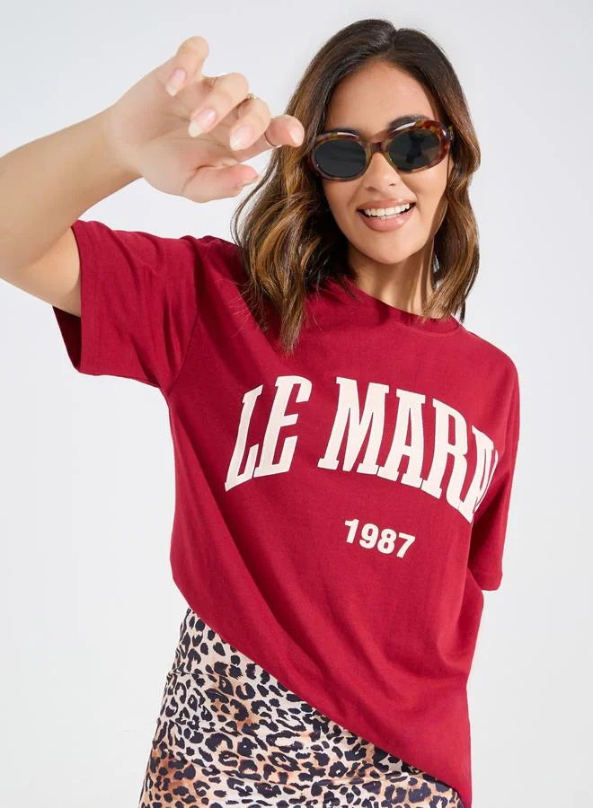 Styli Oversized Le Marias Slogan Print Round Neck T-Shirt