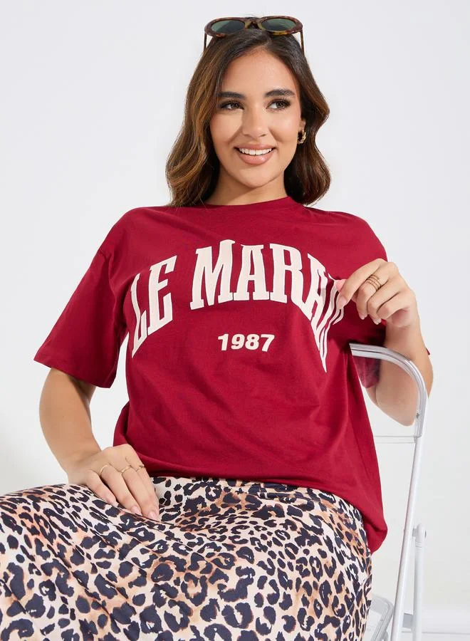 Styli Oversized Le Marias Slogan Print Round Neck T-Shirt