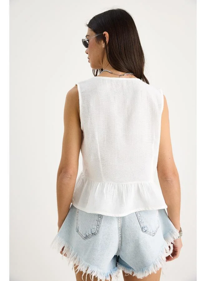 Ginger Bow Tie Up Detail Peplum Top