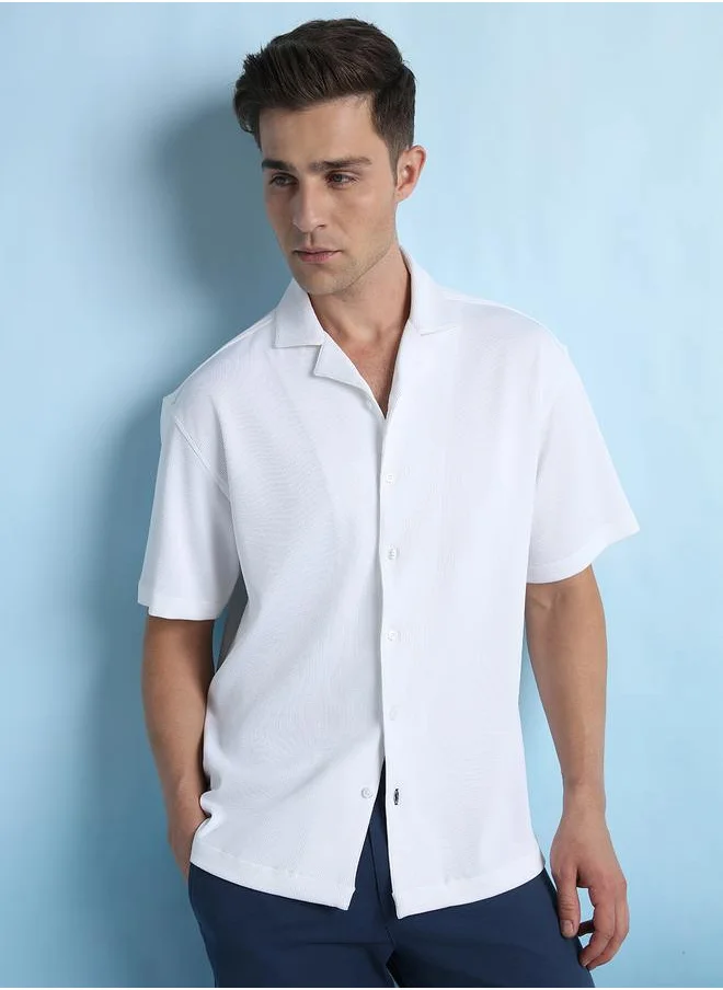 دينيس لينغو White Relaxed Fit Cuban Collar Half Sleeve Shirt for Men, tailored from textured 100% poly fabric for a sophisticated yet casual look – a must-have for versatile styling.