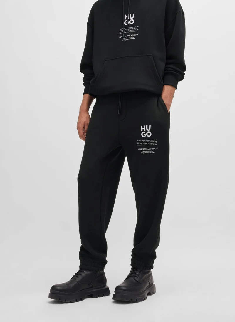 هوجو Relaxed-fit tracksuit bottoms with logo and slogans