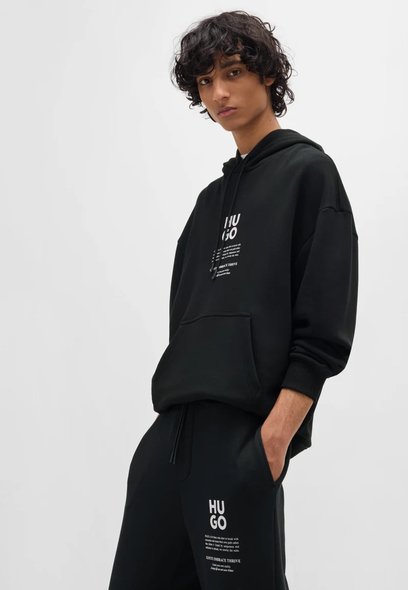 HUGO Black Relaxed-fit tracksuit bottoms with logo and slogans for Men | Best Price UAE