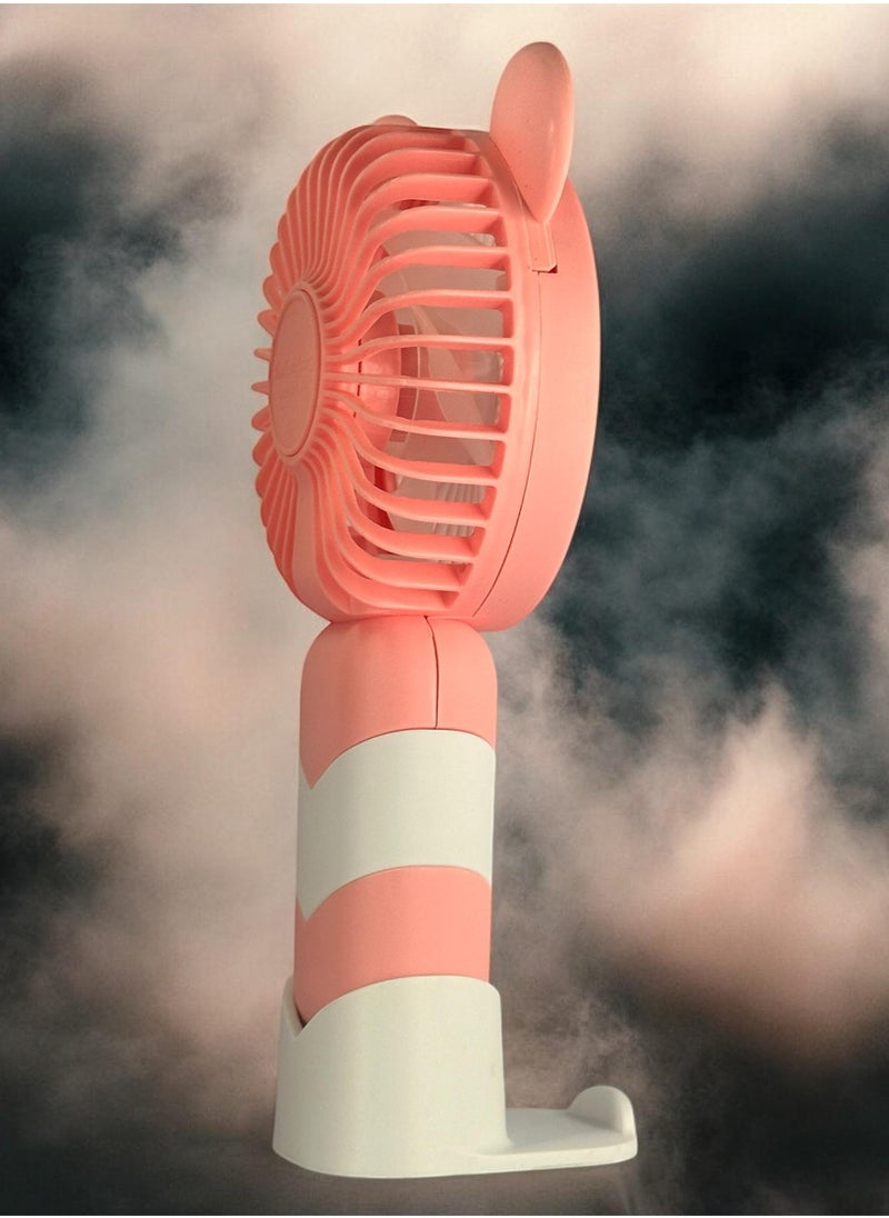 مروحة يدوية صغيرة، تصميم لطيف مزين بأذنين ، حجم صغير وسهل الحمل باليد أو وضعه في الحقيبة، مزودة ببطارية قابلة لإعادة الشحن عبر USB، زر تشغيل/إيقاف، سرعات هواء متعددة، هدية لطيفة للأطفال