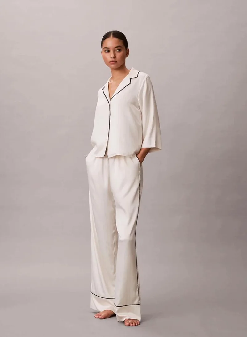 Calvin Klein DOTTED LOGO PINSTRIPE IVORY Satin Sheen Pants for Women | Best Price UAE