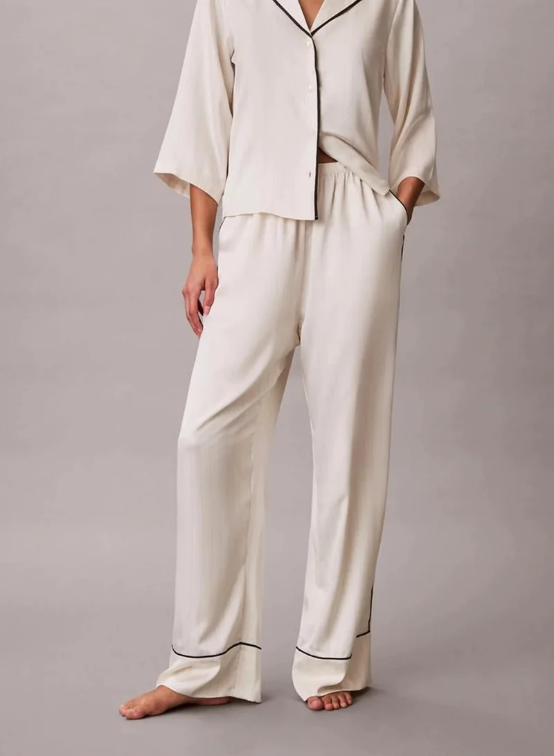 Calvin Klein DOTTED LOGO PINSTRIPE IVORY Satin Sheen Pants for Women | Best Price UAE