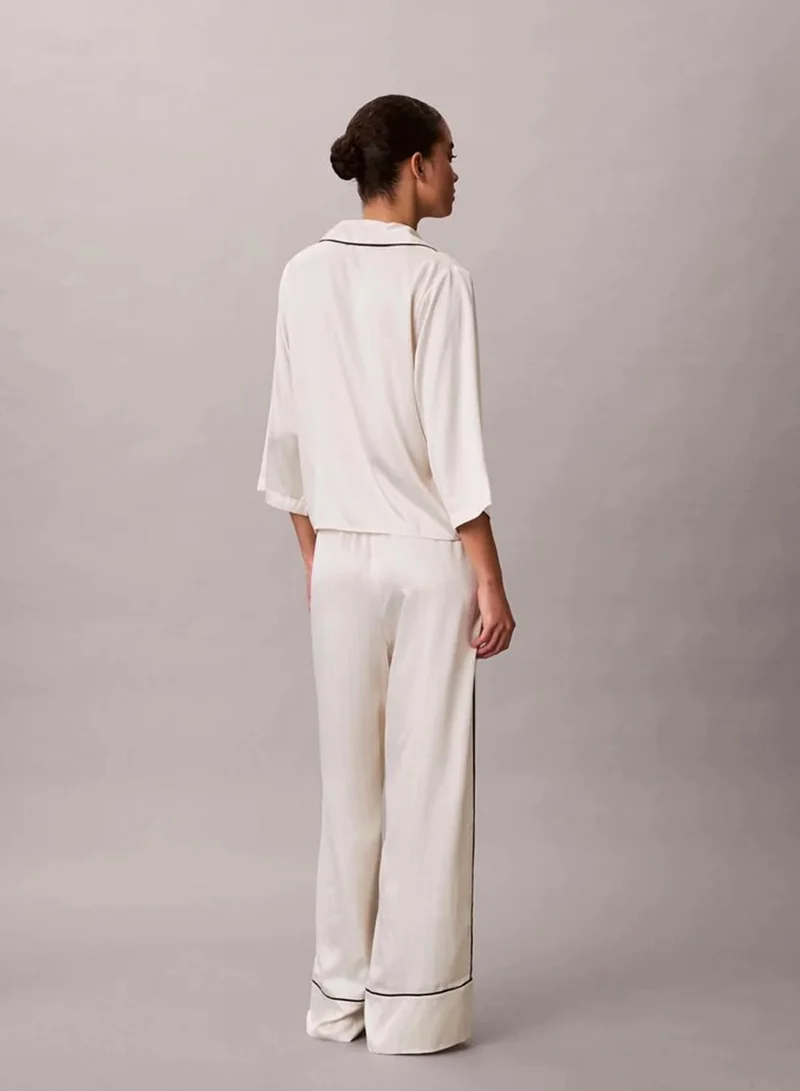 Calvin Klein DOTTED LOGO PINSTRIPE IVORY Satin Sheen Pants for Women | Best Price UAE