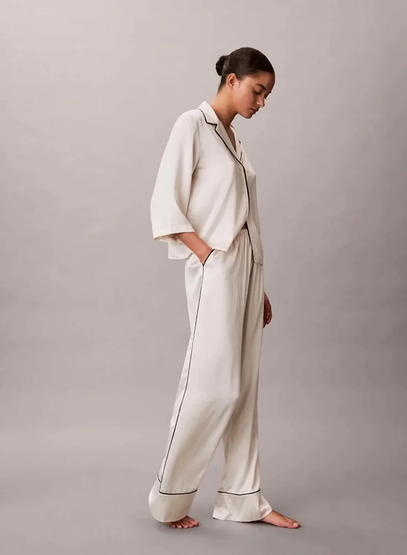 Calvin Klein DOTTED LOGO PINSTRIPE IVORY Satin Sheen Pants for Women | Best Price UAE