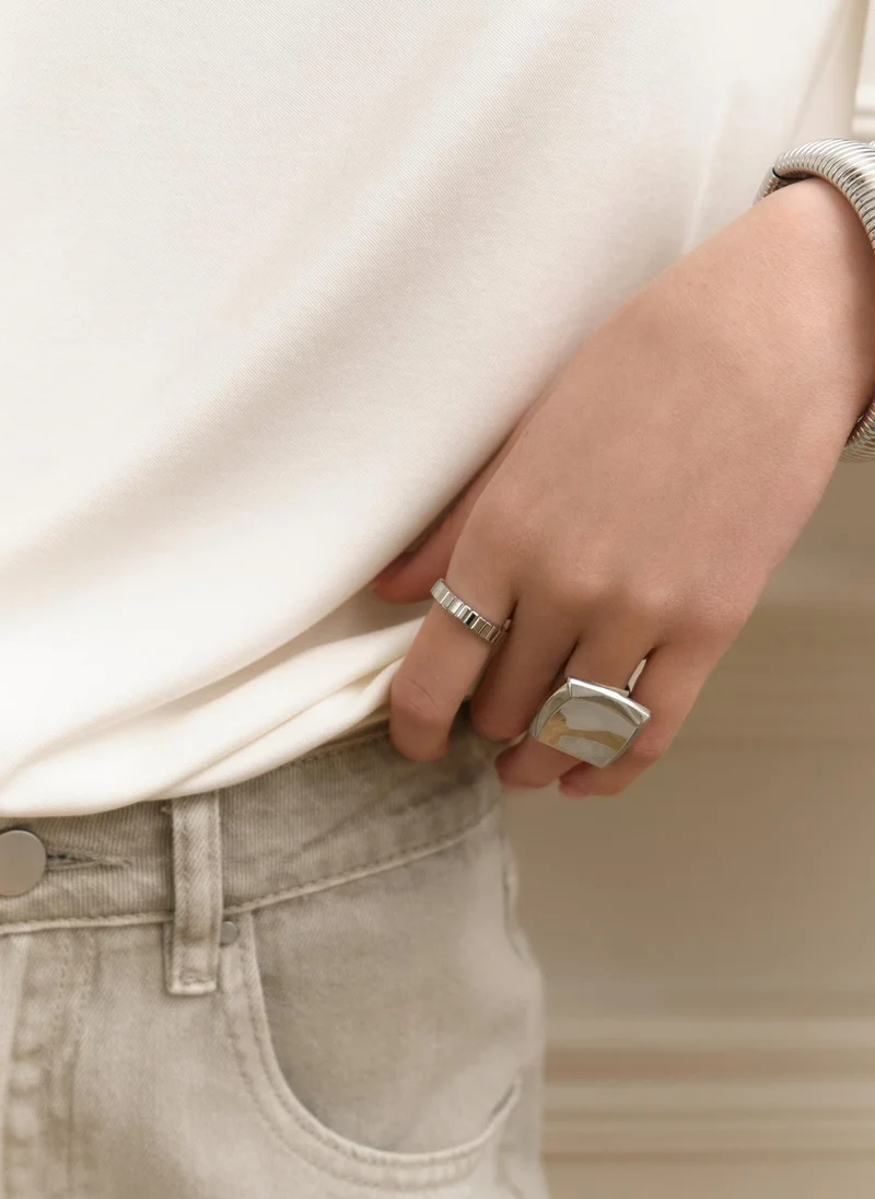 Wide ring in textured metal
