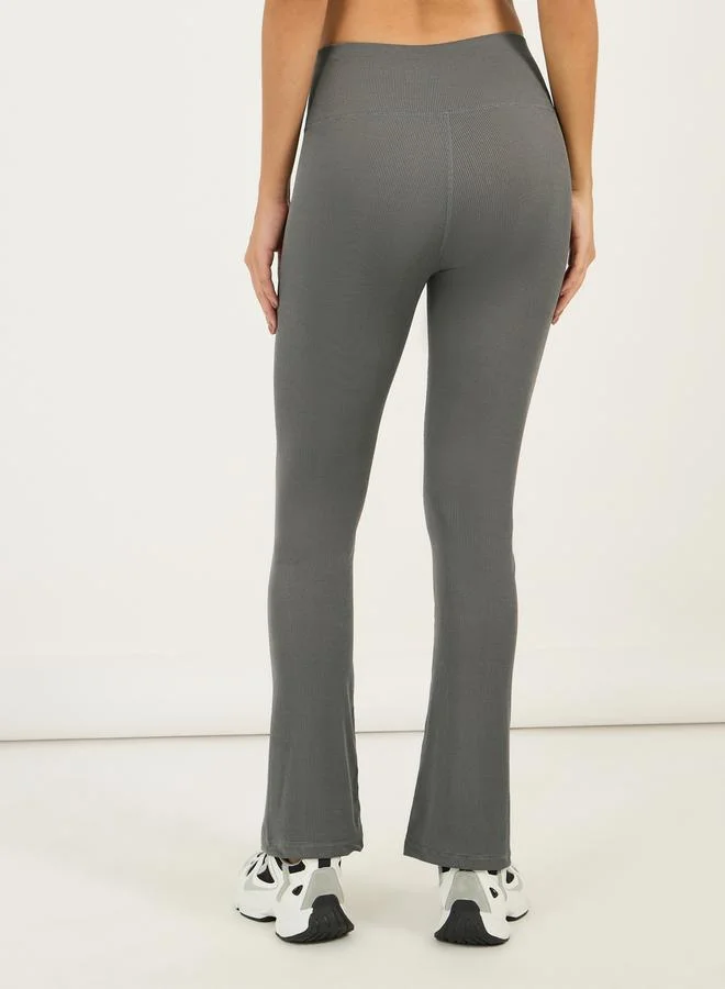 Styli Broad Waistband Ankle Zip Up Detail Flared Pants