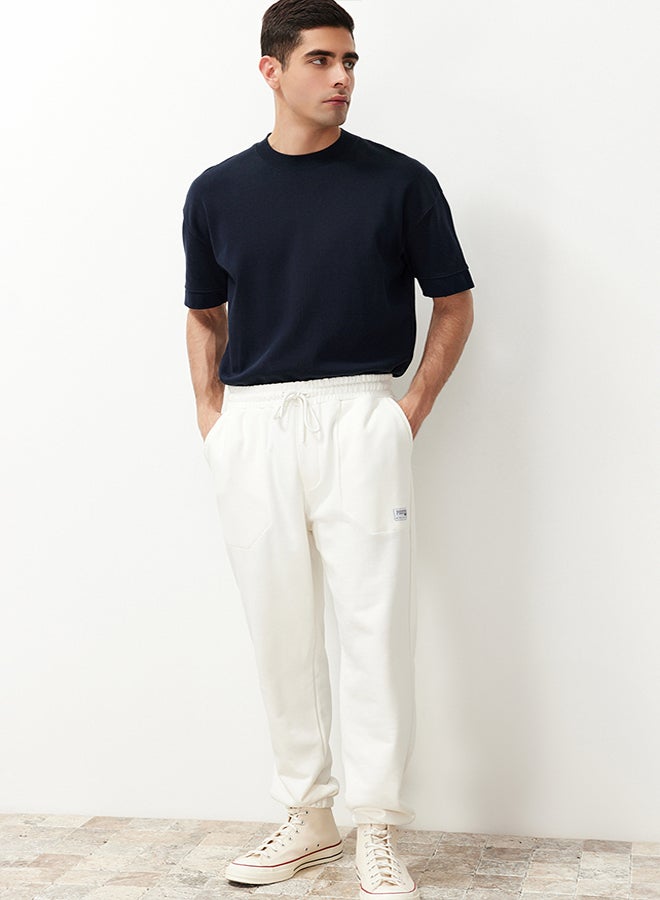 trendyol Ecru Regular Fit Label Appliqued Pockets Stitched Sweatpants TMNSS23EA00010 - Image 4